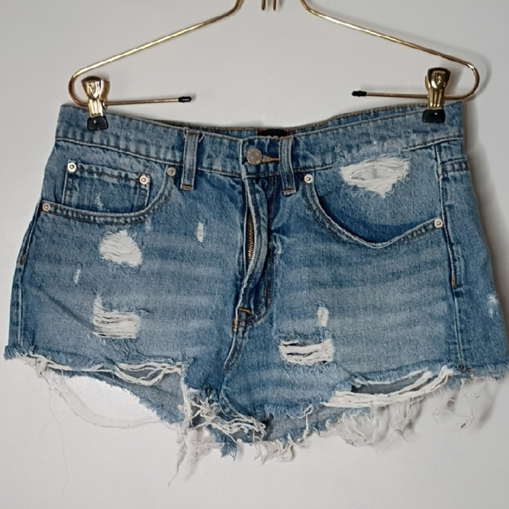 BDG Essential mid-rise cutoff denim shorts in a light wash blue color size 28